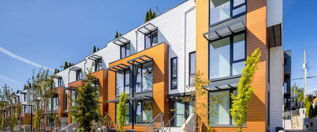 Building exterior with horizontal LUX panels in an orange tone paired with a light brick-look base