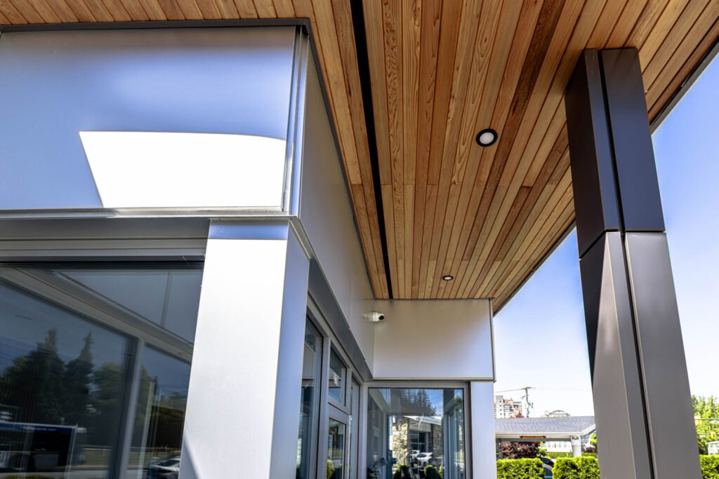 Finished fascia and soffit installation along a roof edge