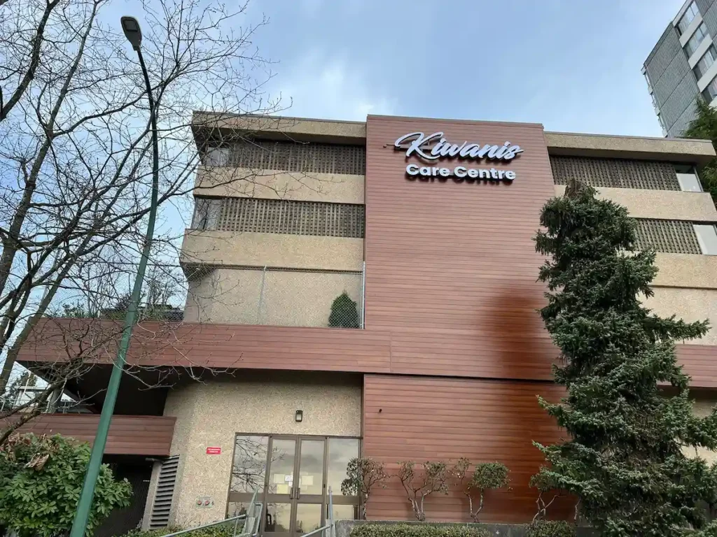 Completed Longboard wood-look aluminum siding installation on a multi-storey commercial building