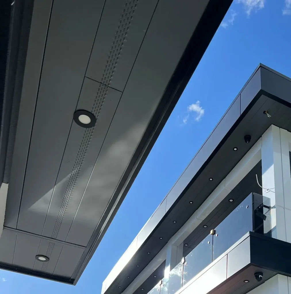 Close-up of soffit panel repair and replacement work in progress